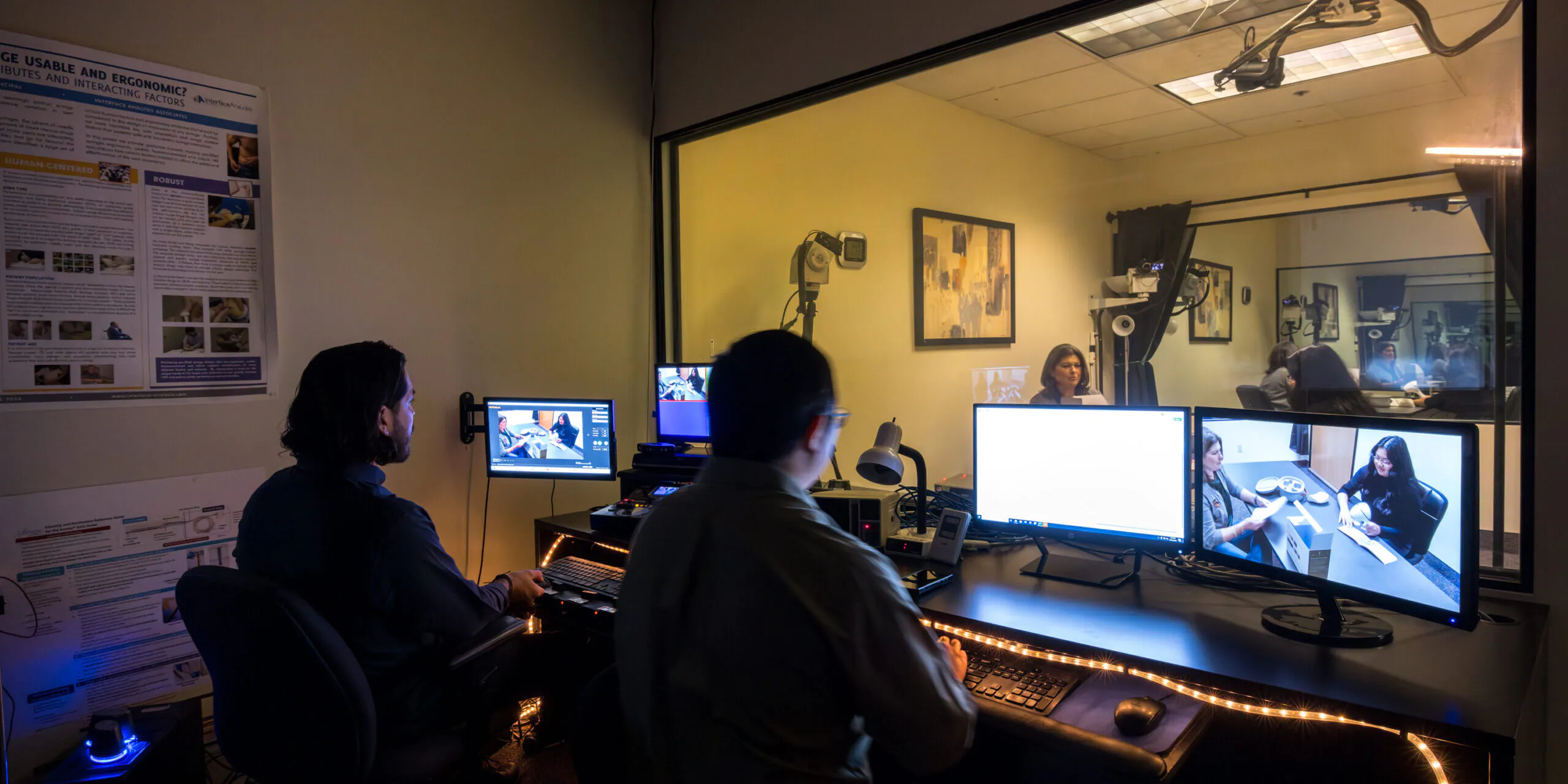 two people watching a study from a viewing room